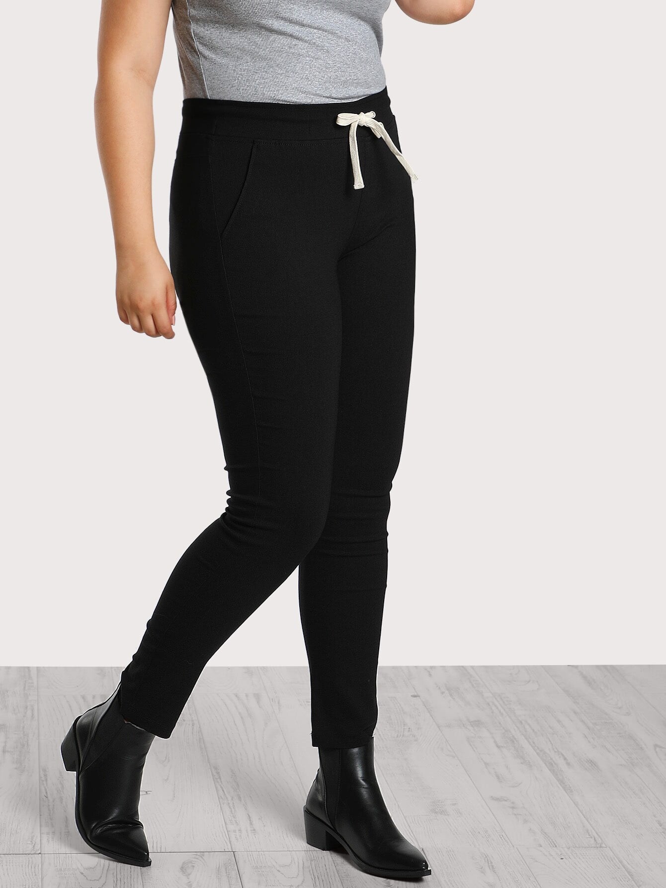 Pantalones pitillo de algodón con cordón negro para mujer